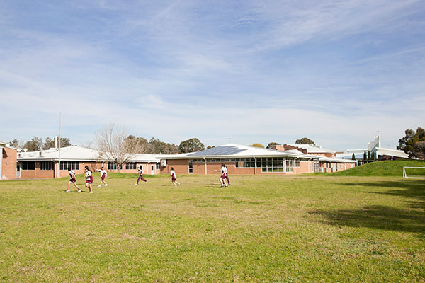 Mary MacKillop Catholic College Wakeley students enjoying green field on school grounds