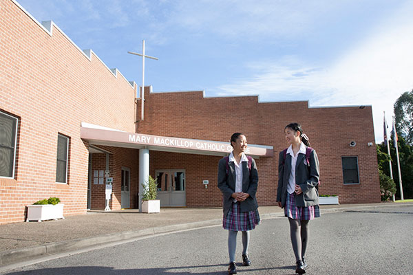 Mary MacKillop Catholic College Wakeley students walking in front of college